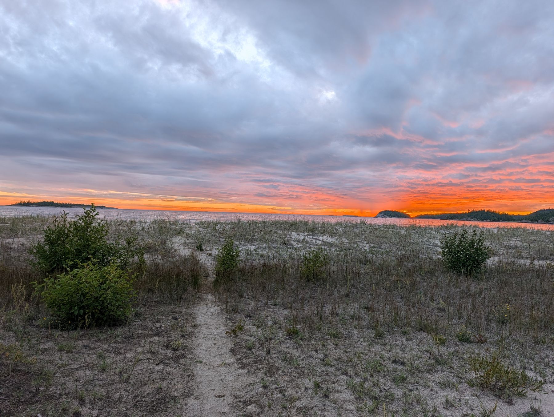 Sunset over the sand at Oiseau Bay
