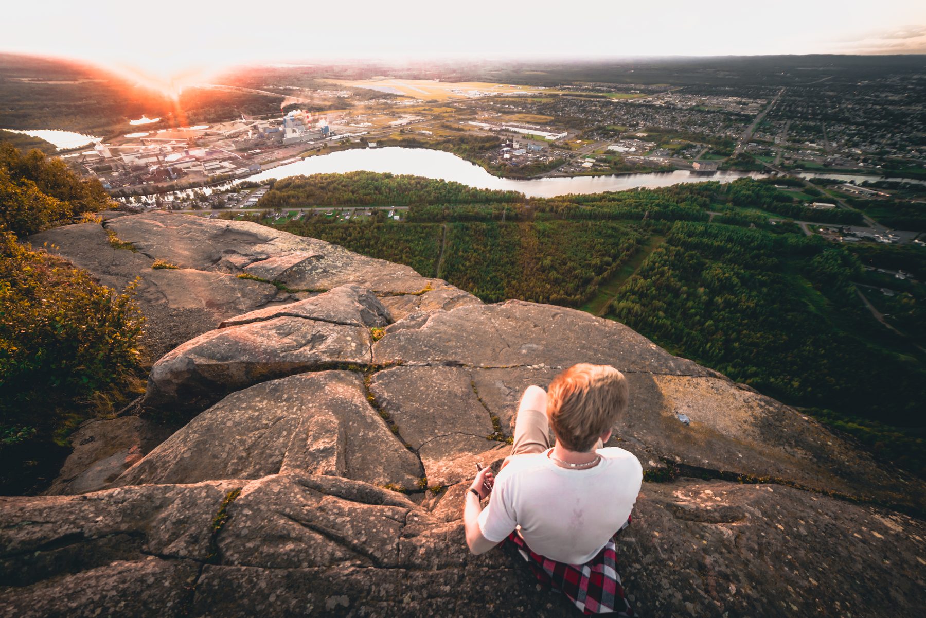 Watching the sun set over the city from the rock edge