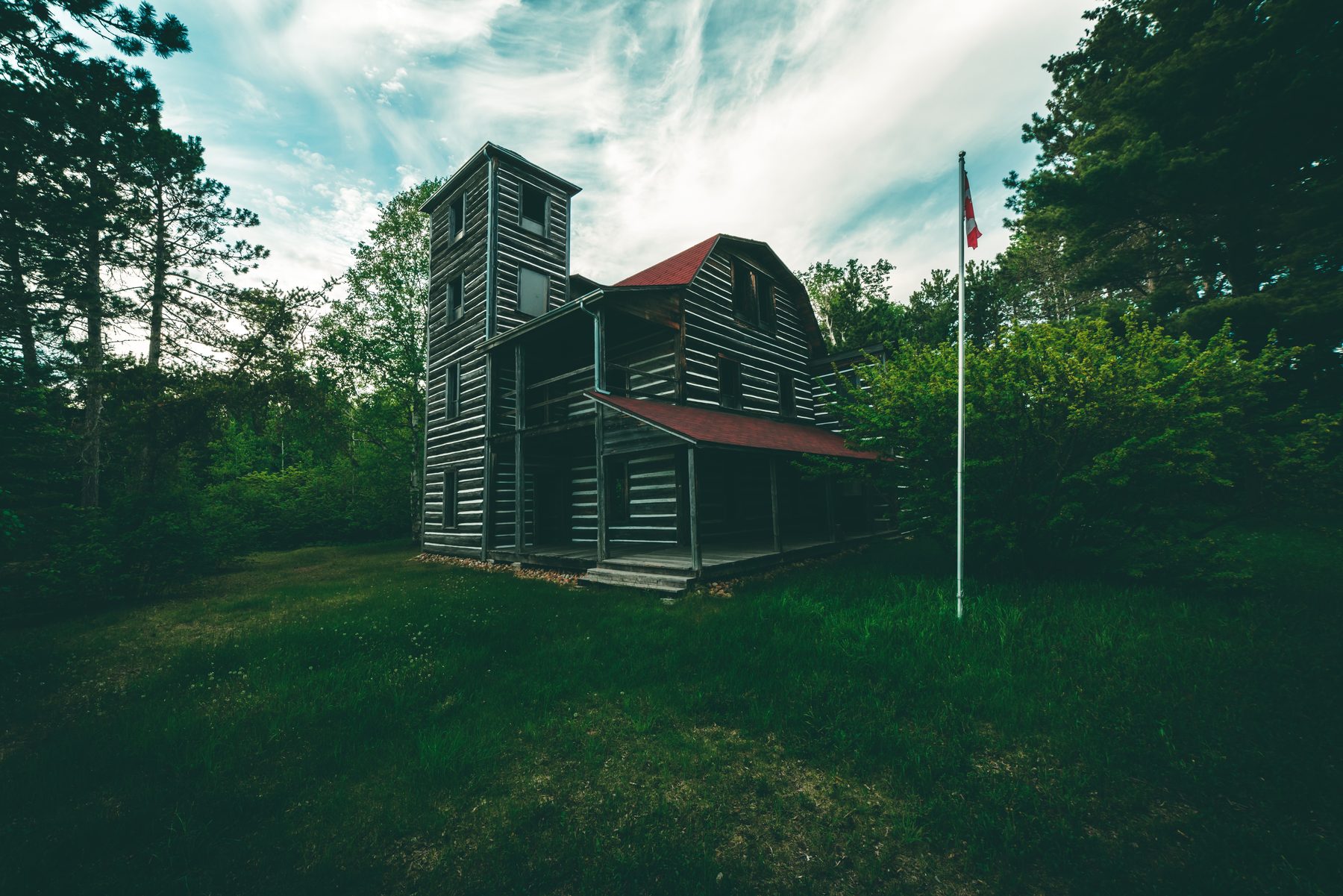 White Otter Castle's log tower, rising above the trees